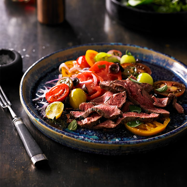 Grilled flat iron steak, tomato and olive salad