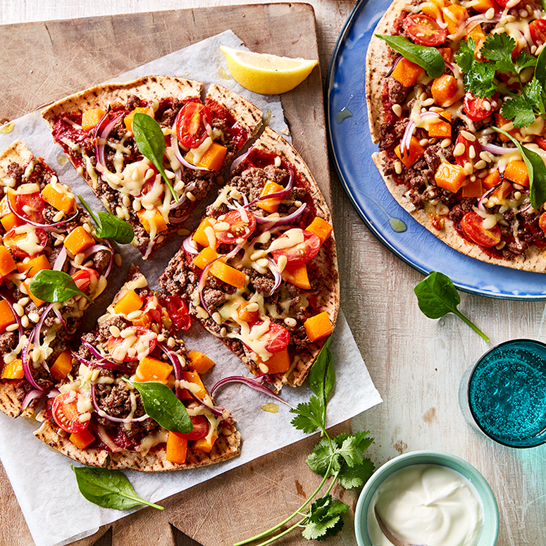 Middle Eastern beef and pine nut pizzas