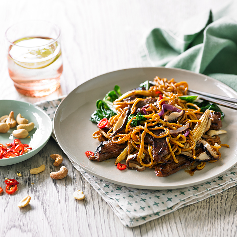 Stir-fried beef with Asian greens and cashews