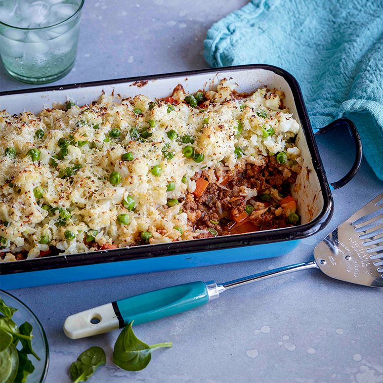 Beef cottage pie with cauliflower and pea topping