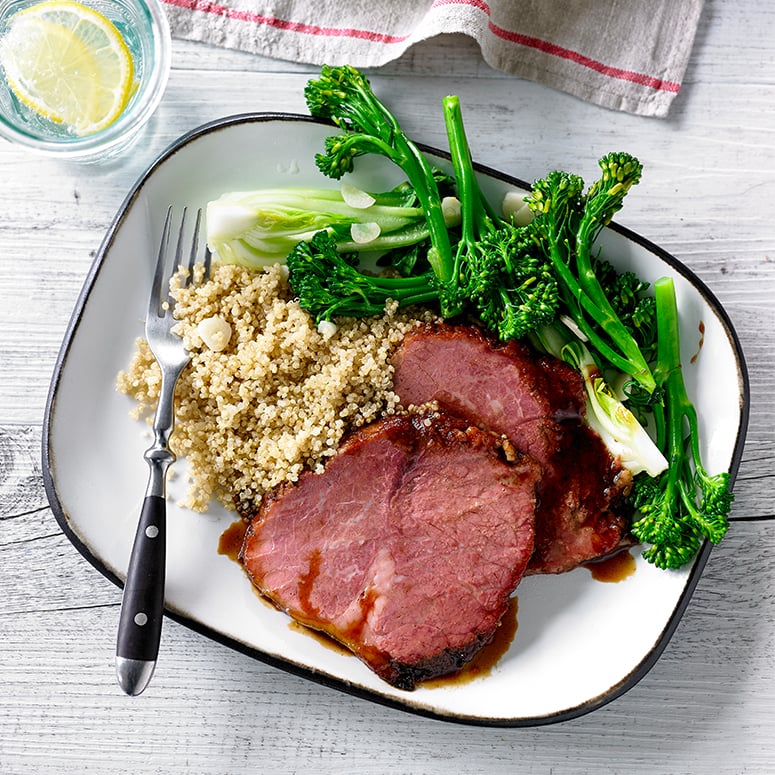 Soy and ginger glazed beef with garlic greens