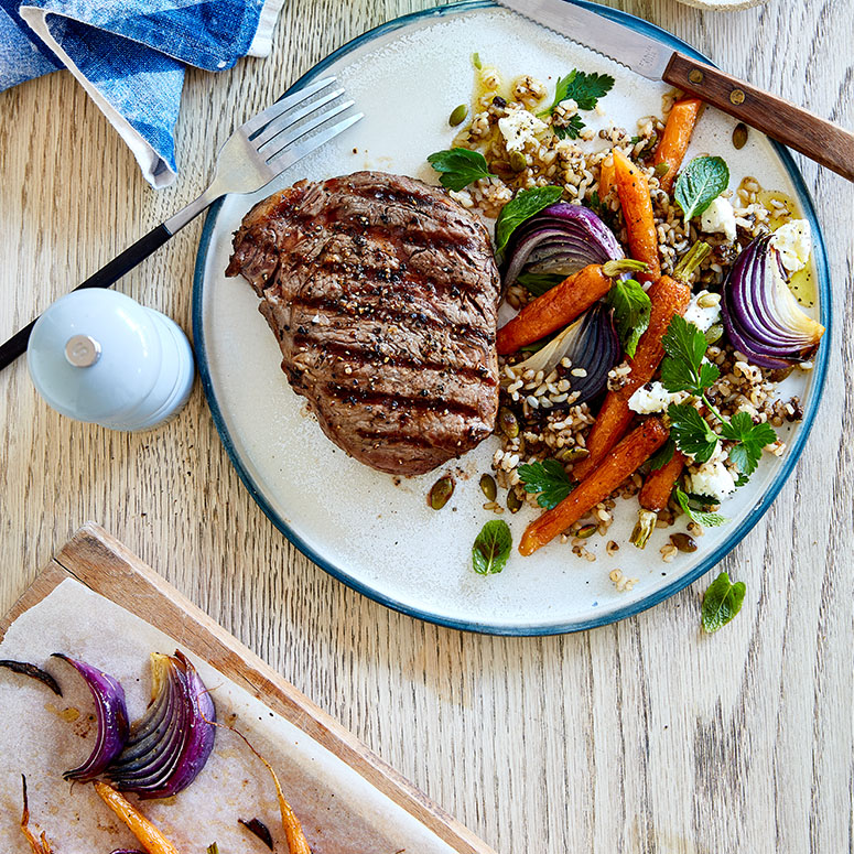Peppered scotch fillet with carrot and herb salad