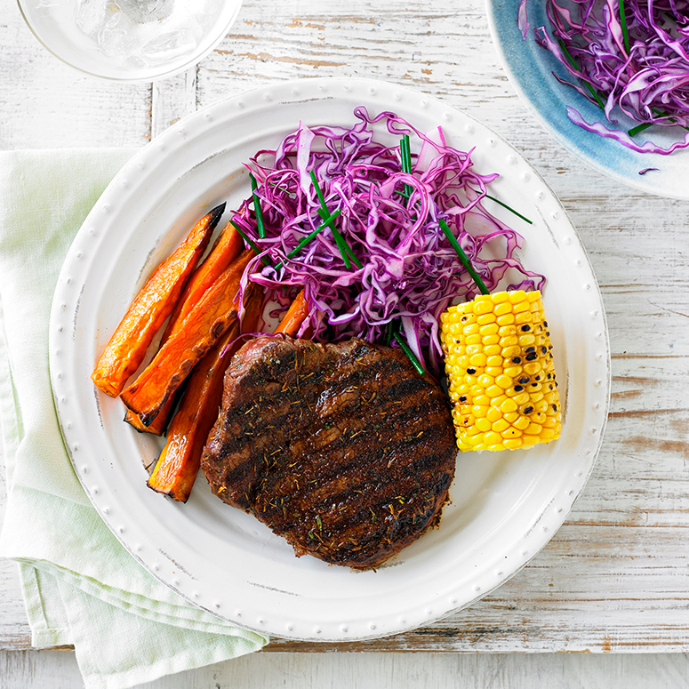 Char-grilled steak with corn and red cabbage
