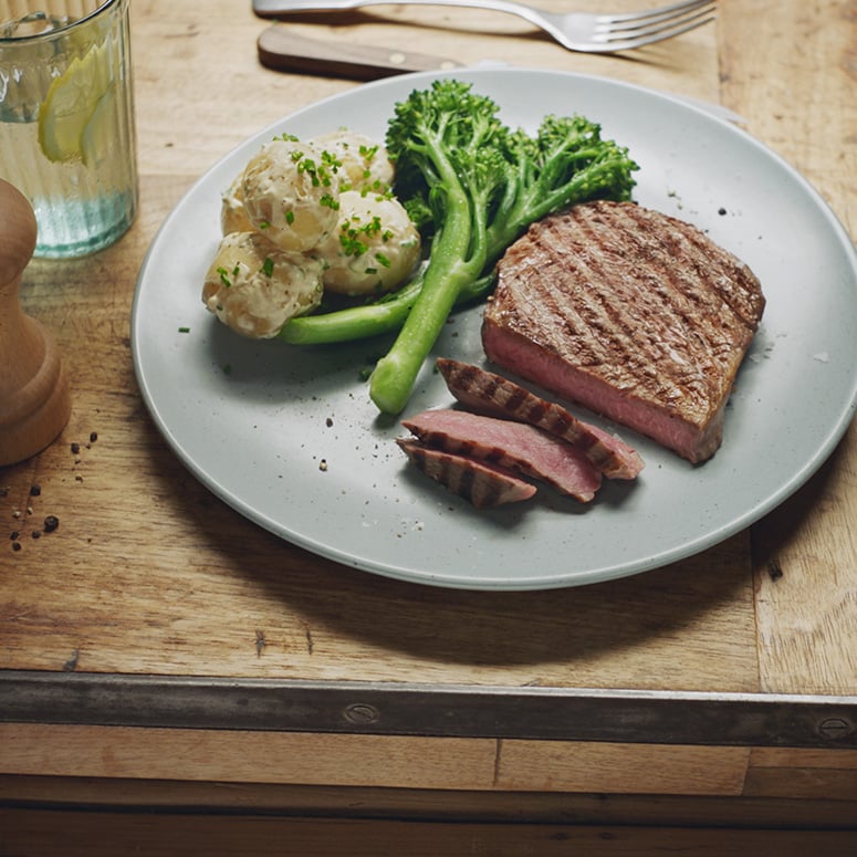 Peppercorn scotch fillet with herbed potatoes