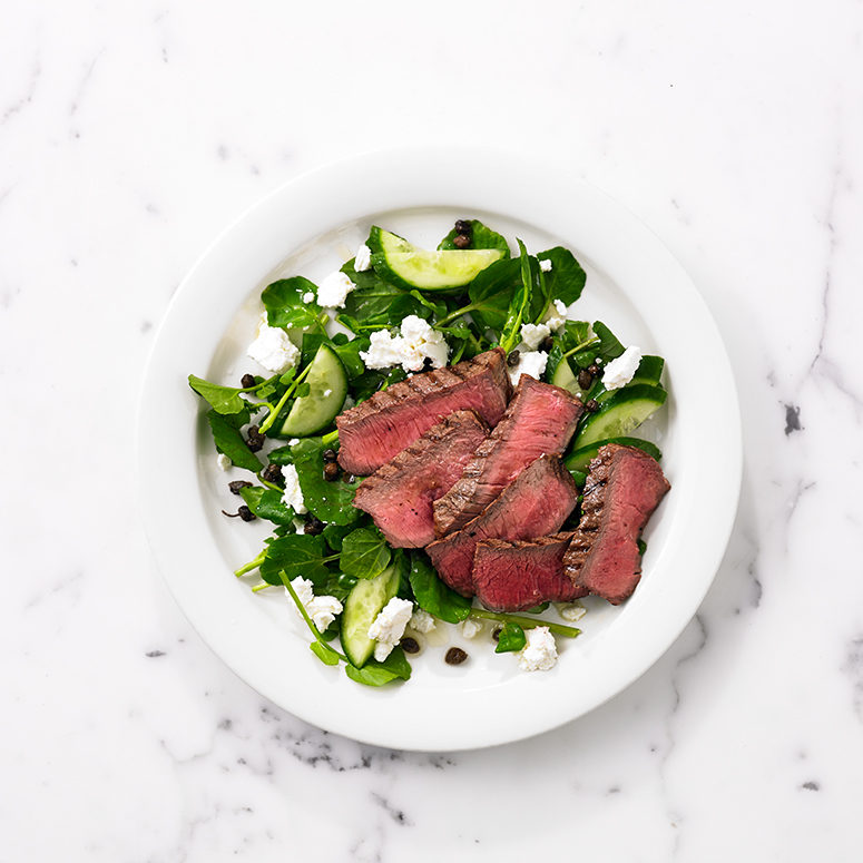 Char-grilled flat iron steak with feta and capers