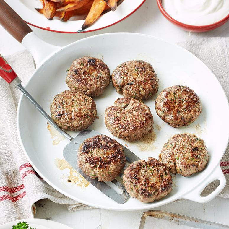 Cheesy rissoles with potato wedges and vegetables