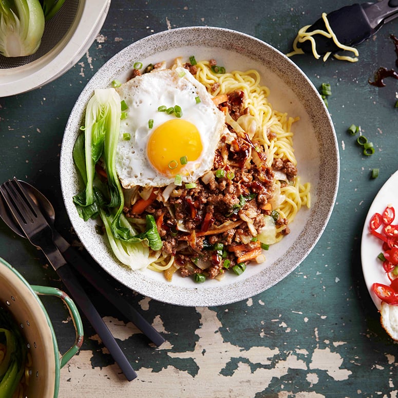 Asian beef mince noodle bowl with fried egg