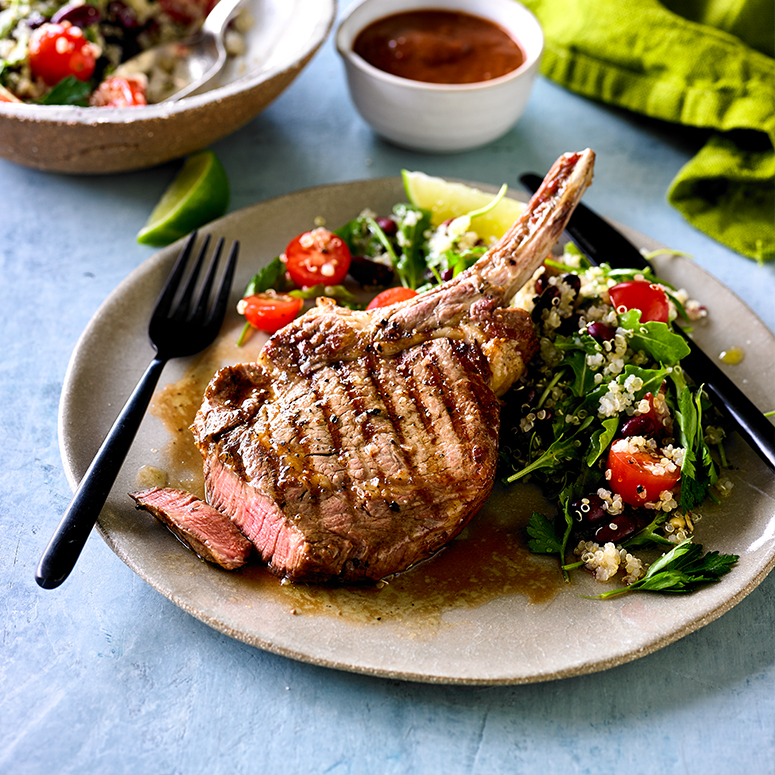 Beef rib eye with spicy quinoa and bean salad