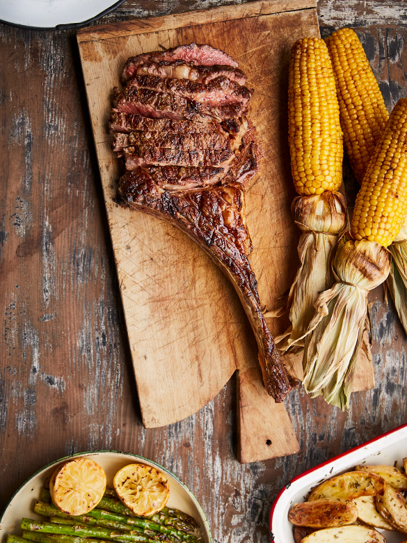 Tomahawk Steak with Potatoes, Corn and Asparagus